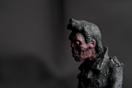 Creepy figure of a zombie on a black background. Halloweenの写真素材