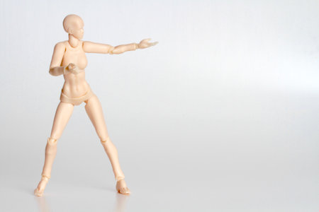 Wooden mannequin isolated on white background. studio shot.の写真素材