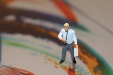 Miniature people : Businessman standing on art bookの写真素材