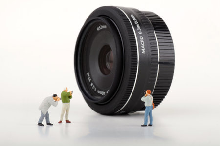 Miniature people: photographer with camera lens. Image use for photography conceptの写真素材