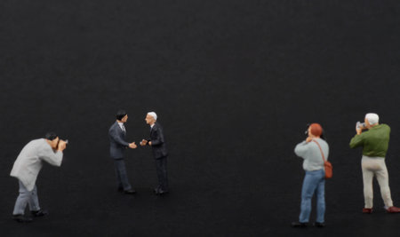 Miniature people : Businessman standing on black background with copy space.の写真素材