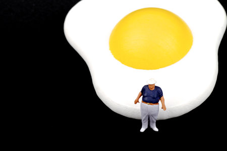 miniature business people standing in a row on white background with copy spaceの写真素材