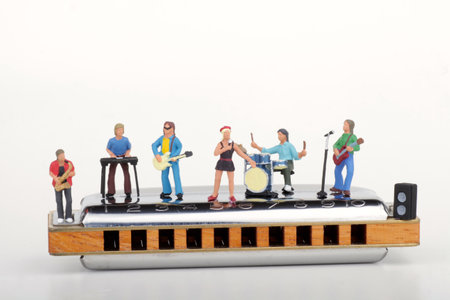 Miniature people : Musicians playing musical instruments on a white backgroundの写真素材