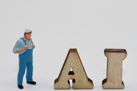 Miniature people : Plumber standing beside the word AI on white backgroundの写真素材