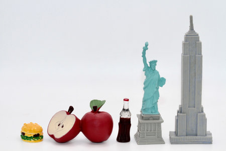 Statue of Liberty, apple and bottle of cola on white background