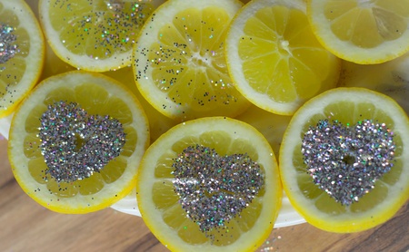 Lemon slices with heart glitters  の素材