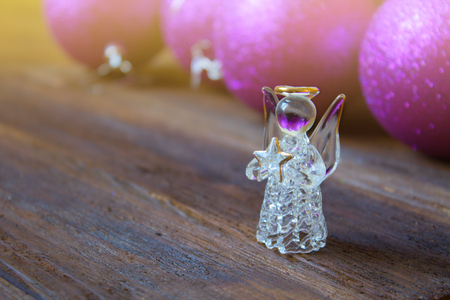 Crystal Angel on the background of Christmas purple balls. new Year decoration. Christmas ornaments, christmas decorationの写真素材