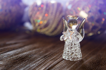 Crystal Angel on the background of Christmas gold balls. new Year decoration. Christmas ornaments, christmas decorationの写真素材