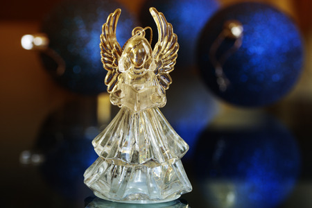 Crystal Angel on the background of Christmas balls. new Year decoration. Christmas ornaments, christmas decorationの写真素材
