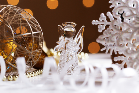 Christmas angel. Crystal Angel on the background of Christmas gold balls. new Year decoration. Christmas ornaments christmas decorationの写真素材