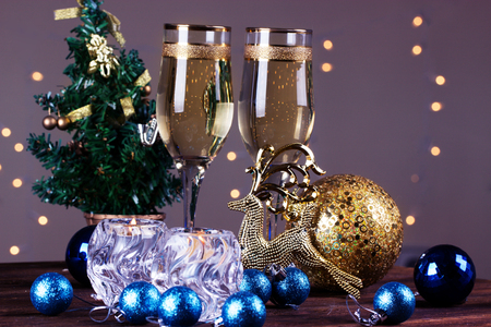 glasses of wine on the background of Christmas decorations. Christmas decorations with wineglass. toasting with champagne glassesの写真素材