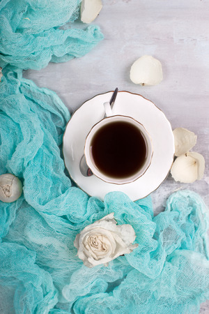 Morning. Cup of coffee rose flowers. Flat lay top viewの写真素材