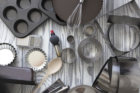 Kitchen Tools. cooking utensils for baking. various shape and size container for baking use. Assorted baking utensils on a wooden backgroundの写真素材