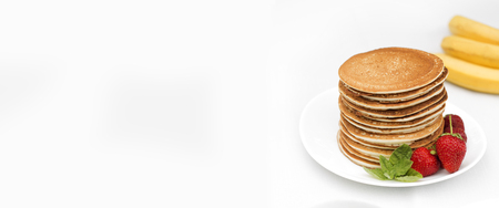 Homemade pancakes with fresh strawberries and honey. Pancakes for Breakfast.Gluten-free: Pancake with rice milk and rice flouの写真素材