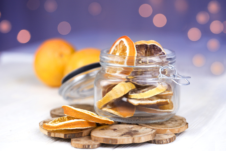 dried oranges in a glass jar. Homemade dried oranges slices in the jarの写真素材