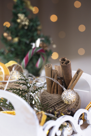 Christmas composition with cinnamon, orange slices, pine cones, Christmas ballsの写真素材