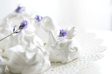 meringue decorated with lavender. French meringue cookies, macro shot.の写真素材