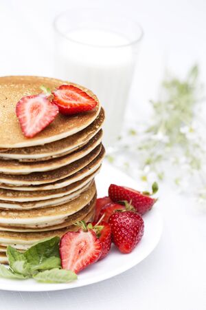 Homemade pancakes with fresh strawberries and honey. Pancakes for Breakfast.Gluten-free: Pancake with rice milk and rice flourの写真素材