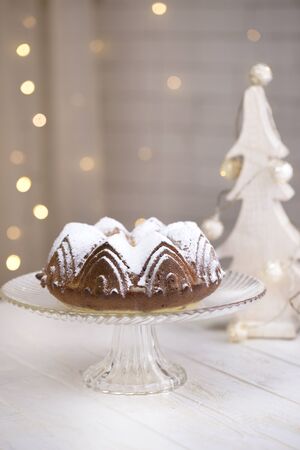 Tasty homemade cake. homemade cake with blurred lights background. cake with sugar powder,の写真素材