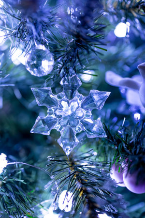 A simple and elegant Christmas tree decorated with white lights and a few delicate ornaments....