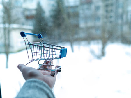 Online shopping concept. Shopping cart, small boxesの写真素材