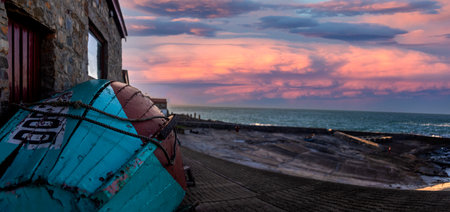 Beautiful photo and scenery of a fishing boat in the South African location of Hermanus with the ocean in the background, this is an ideal place for whale watching.の写真素材