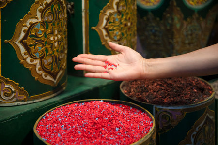 Hand of a beautiful woman in a store selling spices enjoying the same in the Jemaa el Fna square in the city of Marrakech in Morocco, this is a very beautiful Islamic and Arab place.の写真素材