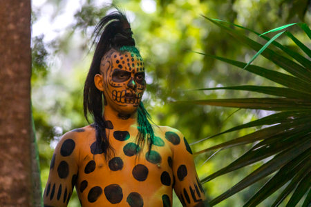 Xcaret, Mexico, December 21, 2022 - Great jaguar Mayan warrior preparing the combat of the Mayans in the Xcaret park in Mexico, it is a pre-Hispanic civilization with an old and unique culture.のeditorial素材