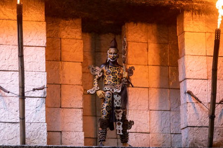 Xcaret, Mexico, December 24, 2022 - Large Mayan jaguar warrior guarding the entrance to a Mayan village in Mexico's Mayan Riviera at Xcaret Park, a popular destination for travelers and tourists.のeditorial素材