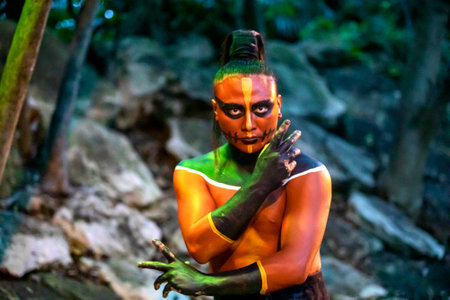 Xcaret, Mexico, December 24, 2022 - A look of a great Mayan warrior ready to dance and fight in the Mayan Riviera of Mexico, at the Xcaret park which is a very popular place for travelers and touristsのeditorial素材