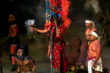 Xcaret, Mexico - January 25, 2023: Beautiful pre-Hispanic dance of the Xcaret park in the tropical jungle of the Mayan Riviera, where an ancient archaeological civilization and symbolism lived.のeditorial素材