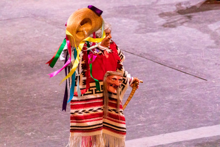 Xcaret, Mexico - January 29, 2023 - Elderly people dancing and enjoying the traditional folkloric dance of the Old Men from the state of Michoacan in Mexico, at Xcaret Park.のeditorial素材
