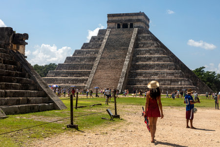 Chichen Itza, Mexico; April 6, 2023: Tourists enjoying the amazing Kulkulcan pyramid at Chichen Itza, where the temple of the Yucatan Peninsula in Mexico and many street vendors are also located.のeditorial素材
