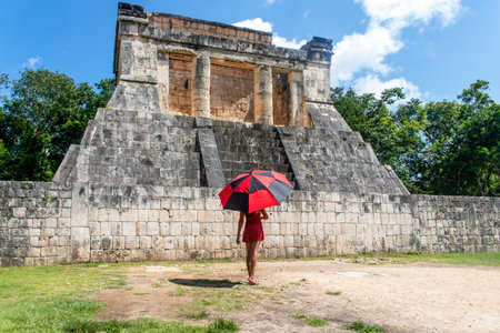 Tourist enjoying and visiting the temple of the bearded man of the ball game at the Chichen Itza...