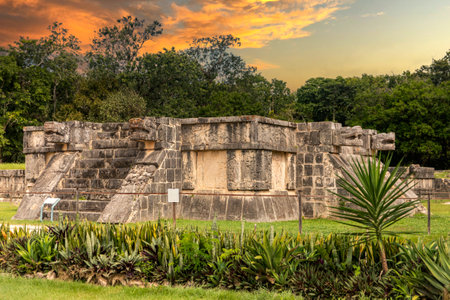 God Kukulkan on the platform of eagles and jaguars under a beautiful orange sunset, this is the feathered serpent of the Mayan civilization. Concept pyramid of Chichen Itza.の写真素材