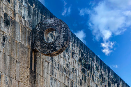 Ball game wall and basket from the Mayan ruins of Chichen Itza in the Yucatan peninsula, these are the old ruins of the Mayan civilization.の写真素材