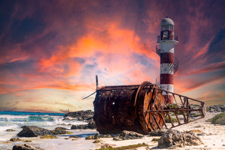 Maritime buoy and lighthouse of tip Cancun in a paradisiacal turquoise beach with a beautiful sky at sunrise or sunset. Marine watchtower in the Mayan Riviera an ideal vacation spot. Vacation concept.の写真素材