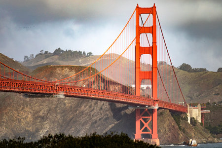 Golden Gate Bridge in the city of San Francisco, in the state of California in the USA, under a cloudy sky and clouds. Concept America.の写真素材