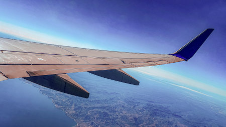 Airplane flying over the Sea of Cortez and the Pacific Ocean approaching an airport in the Mexican...