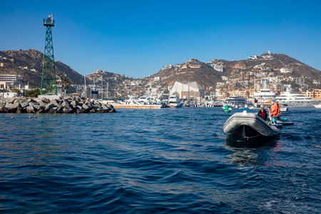 Cape Saint Luke, Mexico - January 10, 2023: person leaving in his speedboat from the port to the high seas and it is a place near the Arch Cape Saint Luke Marine Concept.のeditorial素材