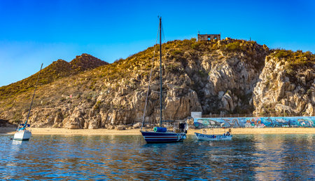 Cabo San Lucas, Mexico - January 10, 2023: Panoramic view of the black coral beach of Cabo San Lucas in the state of Baja California Sur of Mexico. Ideal place for beach and summer vacations.のeditorial素材