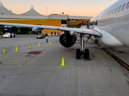 Cabo San Lucas, Mexico, September 5, 2023: People boarding the Volaris Mexican parked plane at Cabo San Lucas International Airport in Mexico's southern Baja California.のeditorial素材