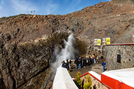 Great panoramic view of the marine geyser of La Bufadora, which is a tourist attraction very visited by people when they go sightseeing in the state of Baja California, Mexico.の写真素材