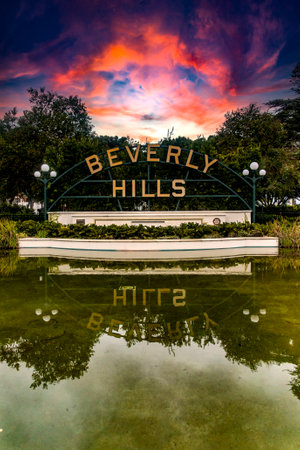 Beverly Hills sign with a beautiful reddish sky in Los Angeles in the state of California in the USA, it is a highly visited place as it is the setting for many movies and series.の写真素材