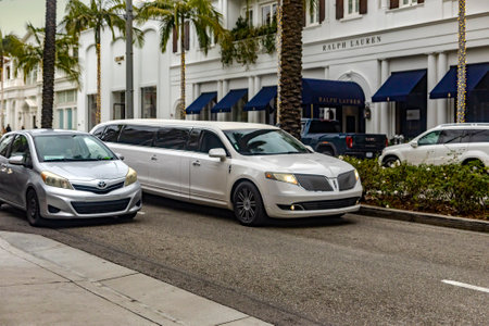 Los Angeles, USA; January 15, 2023: Limousine driving on the famous and luxurious street of Rodeo Drive in Beverly Hills in the city of Los Angeles in California in the United States of America.のeditorial素材