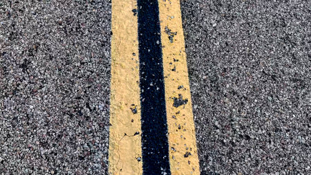 Line of highway road markings, on the highway that crosses the Mojave Desert from Los Angeles in California, to Las Vegas in Nevada.の写真素材