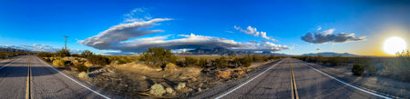 Panoramic view of the mythical route 66 that starts from Chicago to Los Angeles, in the United States of America and crosses the famous Mojave Desert with the hot Californian sun.の写真素材