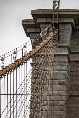 View of the Brooklyn Bridge linking the boroughs of Manhattan and Brooklyn in New York City (USA). It was the largest suspension bridge in the world, record span until 1889.の写真素材