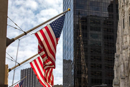 The typical American flags waving in Manhattan, this is the typical decoration of the Big Apple in New York City (USA).の写真素材