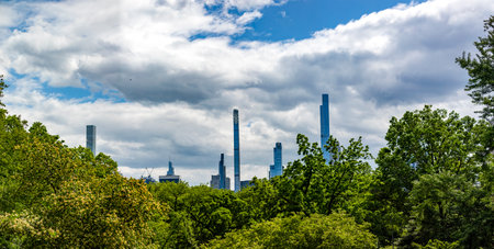 Panoramic view of the New York City skyline as seen from Central Park, which is a public urban park located in the metropolitan district of Manhattan, in the Big Apple in the United States of America.の写真素材